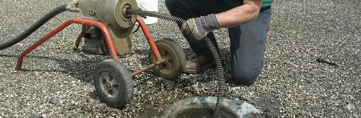 sewer rodding technician actively removing blockages from a sewer line in Long Beach, CA
