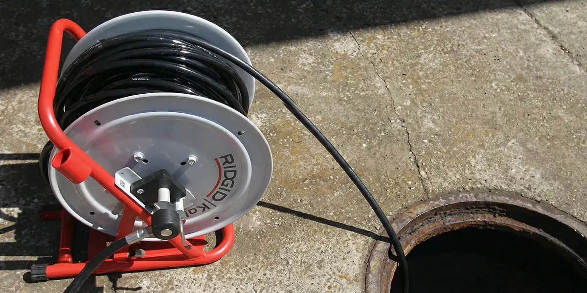 sewer rodding equipment prepared to clear clogged sewer lines in Long Beach, CA