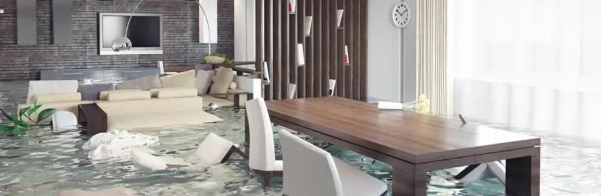 home interior affected by water damage with flooded floors and displaced furniture in Long Beach, CA